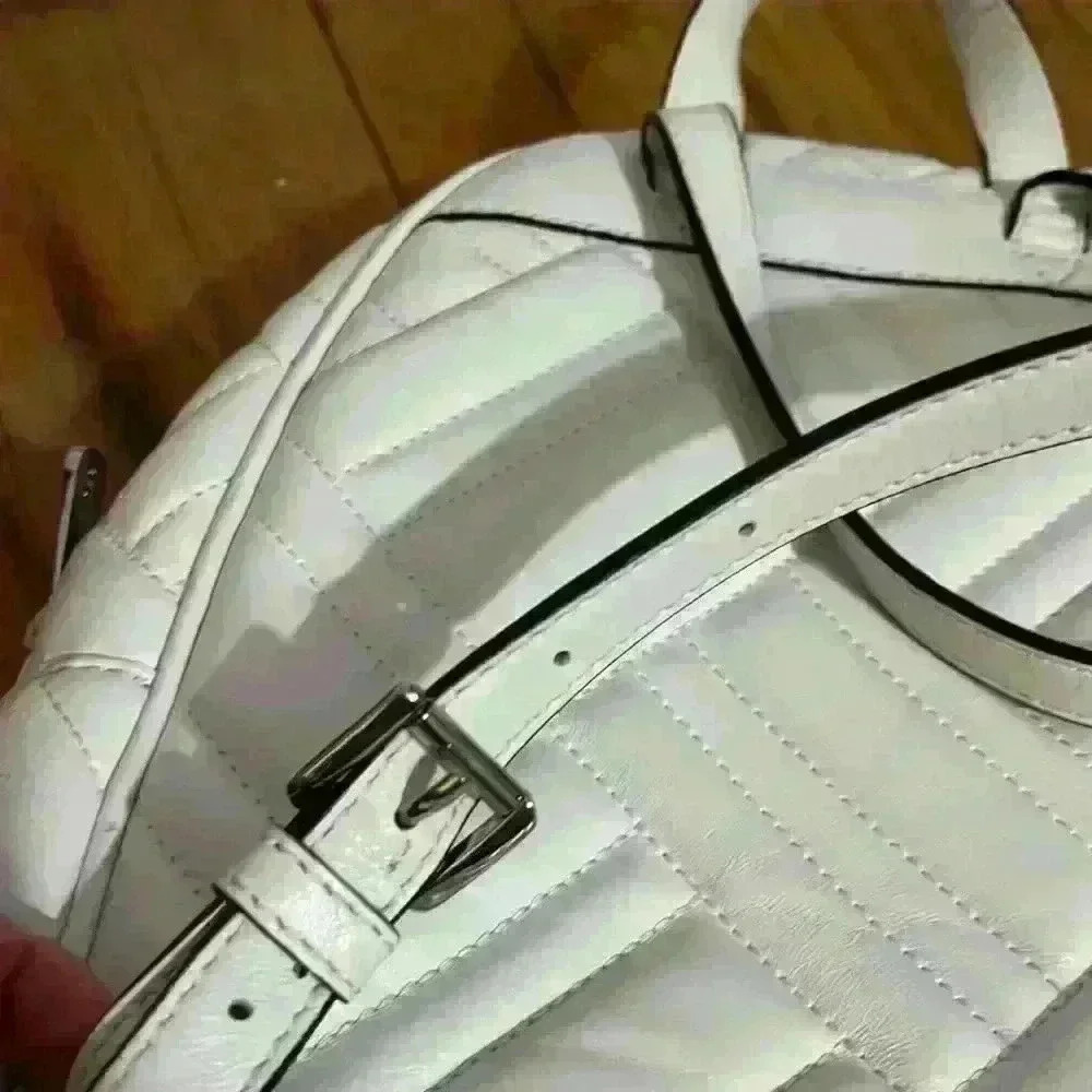 Michael Kors Abbey white quilted backpack. Silver hardware. Two zipper pockets. - Picture 9 of 12